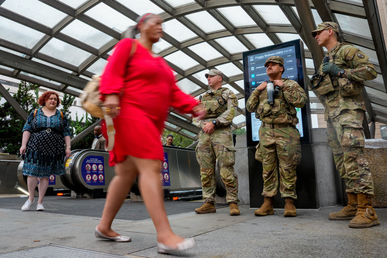 National Guard troops from South Carolina stand outside Foggy Bottom Metro Station on Aug. 20, 2025 in Washington, D.C. 