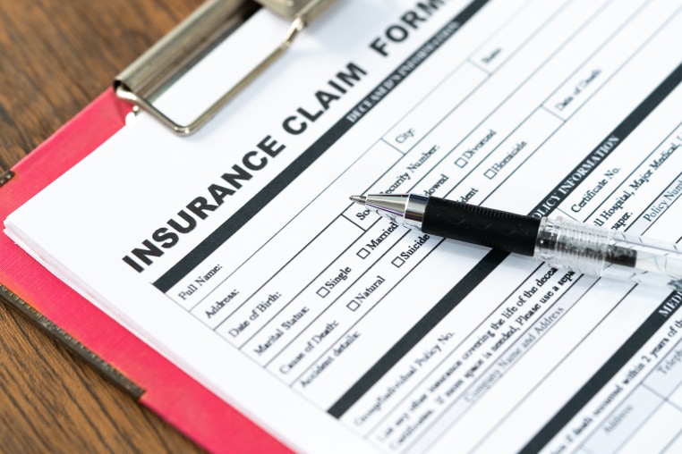 An Insurance claim form on a table