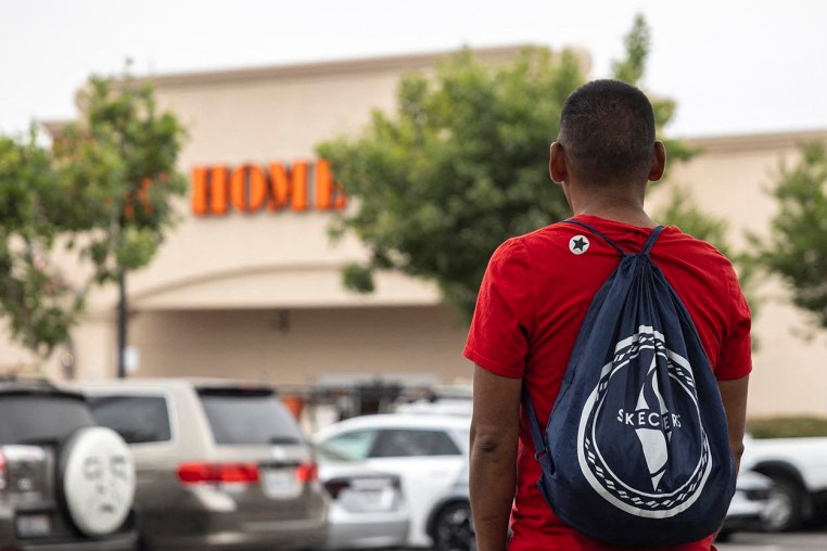 A day laborer waits in the parking lot of a Home Depot as federal immigration conducts raids in Los Angeles on June 20, 2025.   