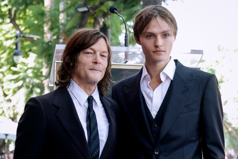Norman Reedus, left, and Mingus Reedes stand next to each other outside