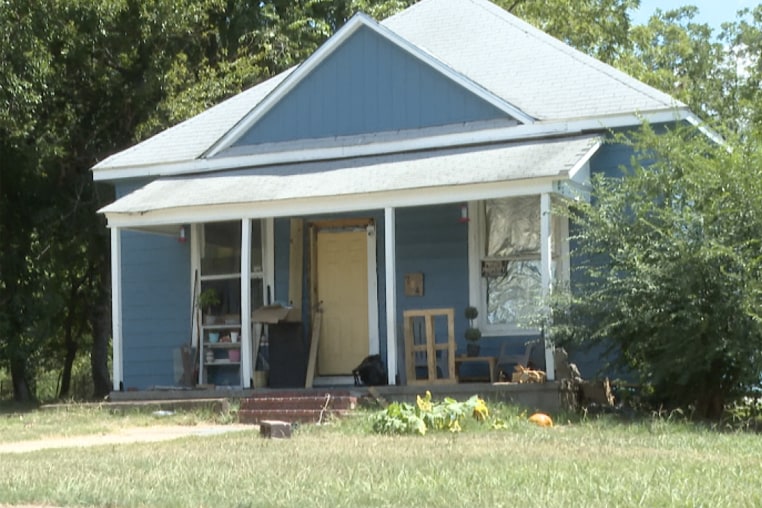 The house in Muskogee, Okla., where the 11-year-old lived where children were exposed to unstable and unsanitary conditions.