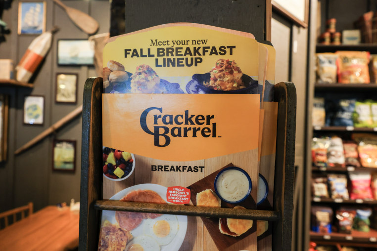 A cracker barrel menu sits on a shelf