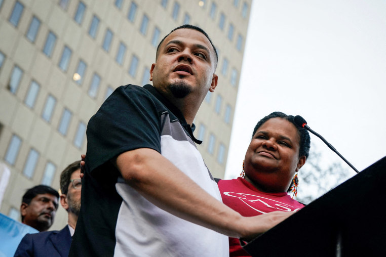 Kilmar Abrego Garcia speaks at a podium