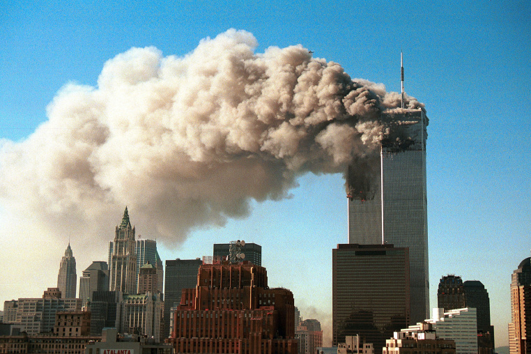 Image: Smoke pours from the twin towers of the World Trade Center after they were hit by two hijacked airliners in a terrorist attack Sept.11, 2001 in New York City.
