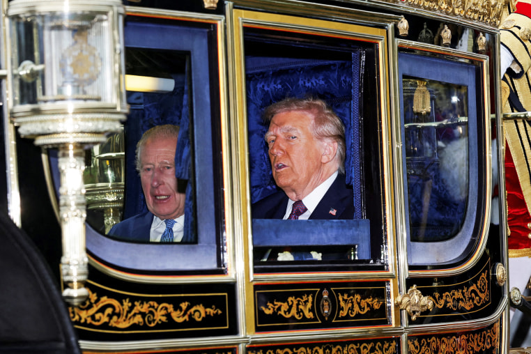Donald Trump next to King Charles inside of a carriage