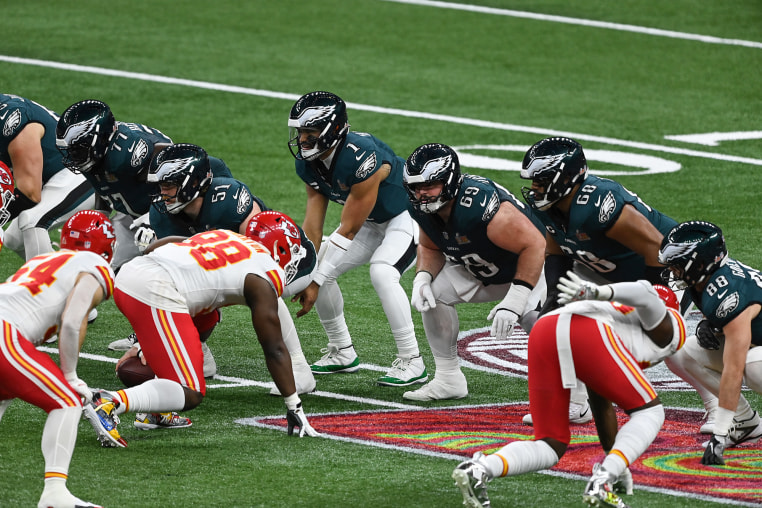Eagles players and Kansas City Chiefs players lined up against each other on the field