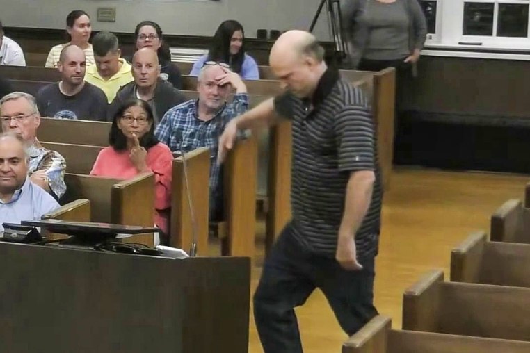 A man running for a New Jersey township committee seat treated attendees of a council meeting to a break dancing routine before asking questions on tax policy and moonwalking away.