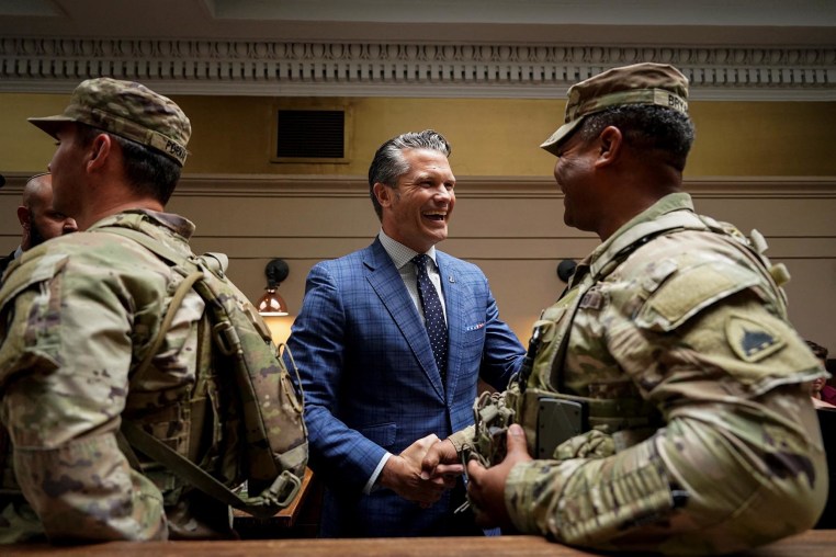 Defense Secretary Pete Hegseth greets a member of the National Guard at Union Station in Washington on Aug. 20, 2025. 