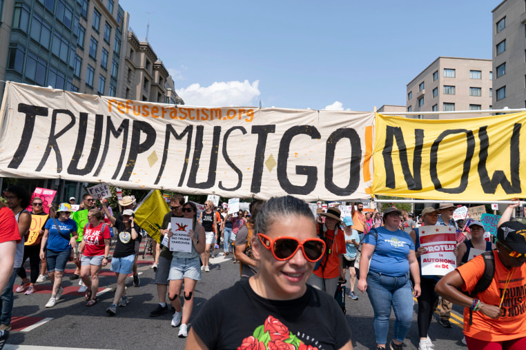 Demonstrators protest against President Donald Trump's deployment of federal law enforcement and National Guard troops in Washington