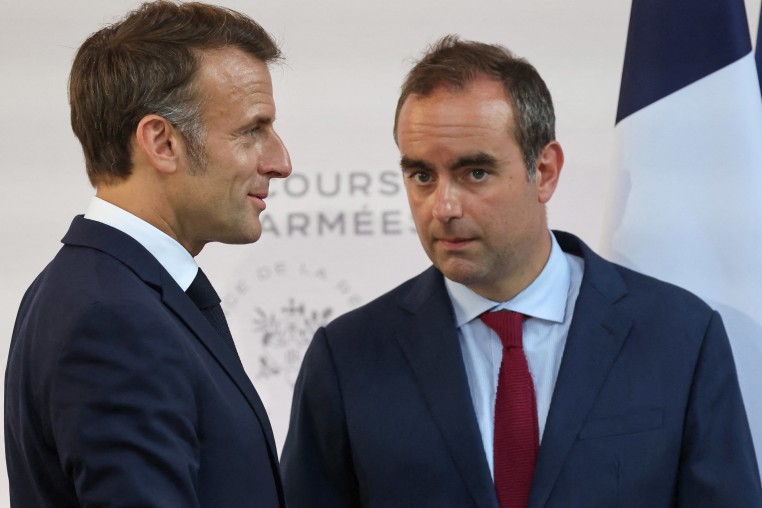 France's President Emmanuel Macron speaks with France's Minister of Armed Forces Sebastien Lecornu in Paris on July 13, 2025.
