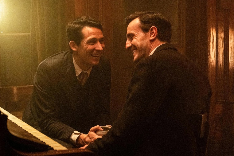 From left, Josh O'Connor and Paul Mescal laugh together, facing each other