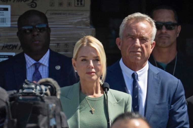 Attorney General Pam Bondi speaks flanked by Secretary of Health and Human Services Robert F. Kennedy Jr. outside Midwest Distribution after it was raided by federal agents on Sept. 10, 2025 in Bensenville, Ill.