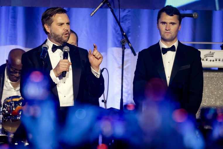 Vice President-elect JD Vance speaks as Charlie Kirk looks on during the Turning Point USA Inaugural-Eve Ball on Jan. 19, 2025.