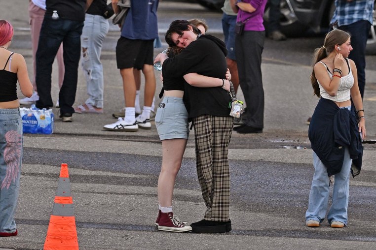 Students reunite with loved ones and classmates after a shooting at Evergreen High School 