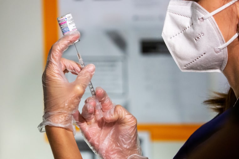 A healthcare worker prepares a dose of a Covid-19 vaccine
