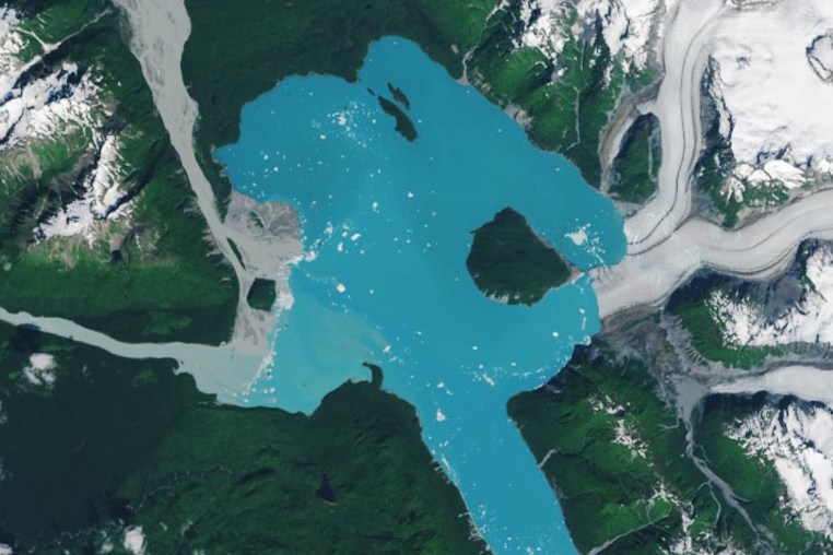 A landmass that was once encased in the ice of the Alsek Glacier is now surrounded by water.