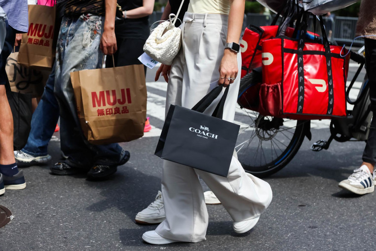 Pedestrians carry shopping bags in New York, on Sept. 6, 2025. 