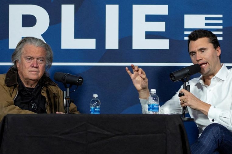 Charlie Kirk conducts a live podcast with Steve Bannon during the AmericaFest 2024 conference  in Phoenix, Ariz., on Dec. 19, 2024.  