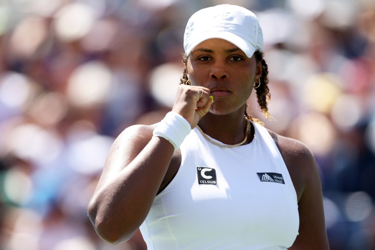 Taylor Townsend in a white cap, looking ahead.