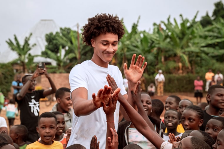Nate Ament plays at a basketball camp in Rwanda during a trip in August.