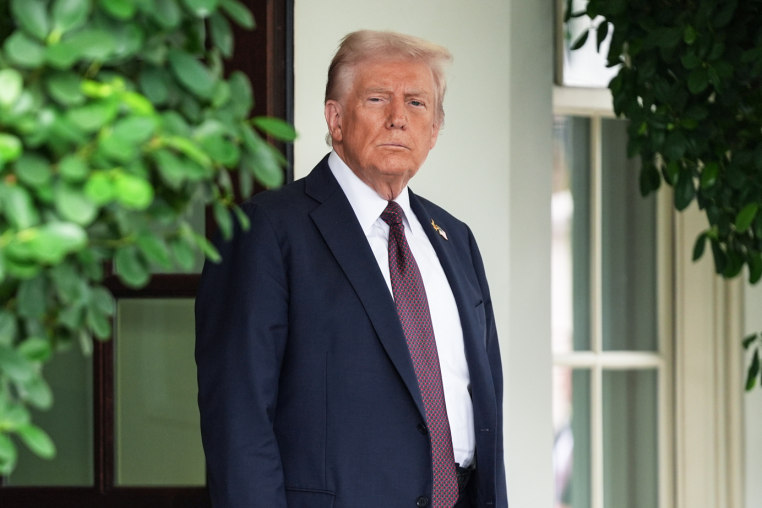 Donald Trump stands outside