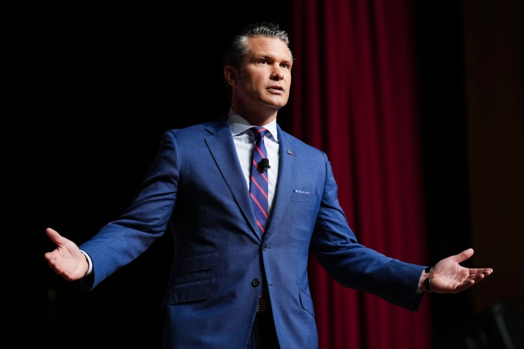 Pete Hegseth speaks on stage