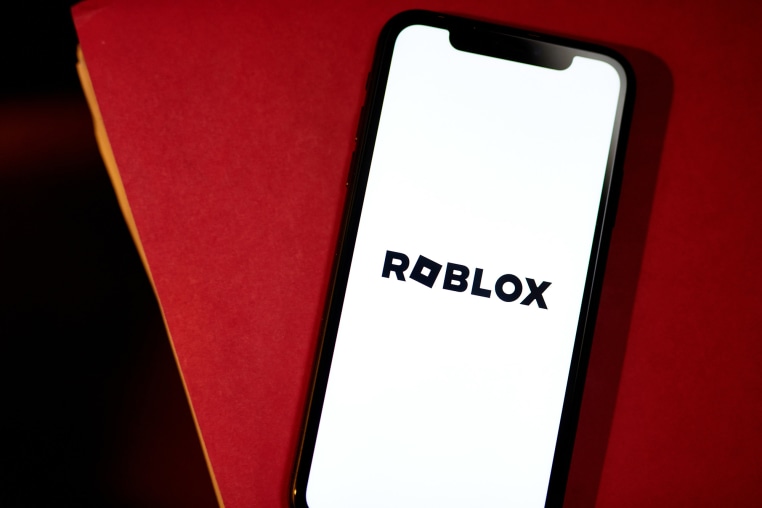 Roblox logo on phone screen