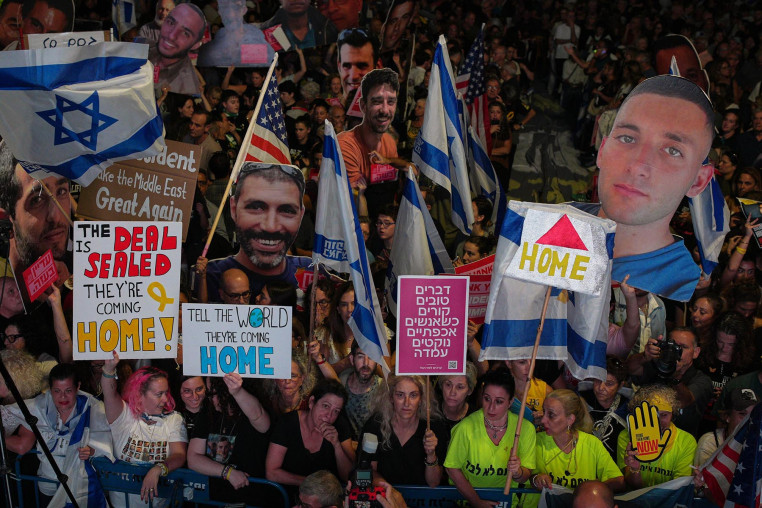 People part in a rally in support of hostages kidnapped by Hamas, at "Hostages square" in Tel Aviv, Israel,  on Saturday, Oct. 11, 2025.