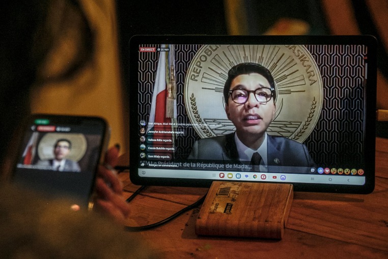 A keenly awaited national address by Madagascar's cornered President Andry Rajoelina, who went missing as calls grew for his resignation, was delayed twice on October 13, 2025 as a group of armed forces tried to take control of the state-owned media.