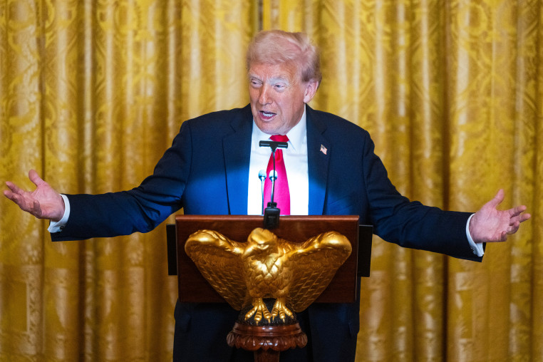 US President Donald Trump speaks during a dinner in the East Room of the White House.