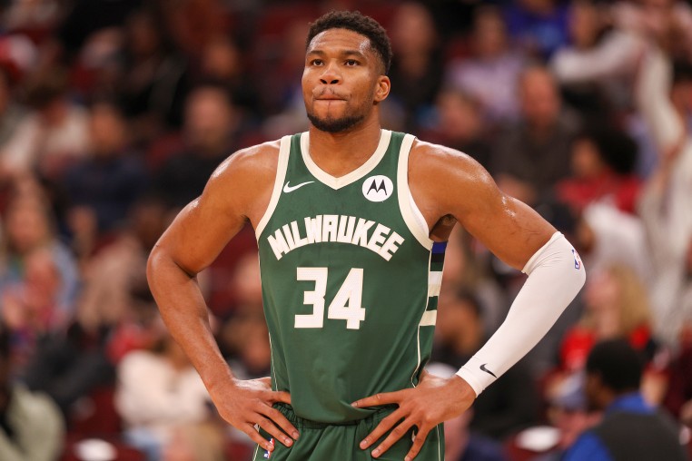 Giannis Antetokounmpo stands on the basketball court