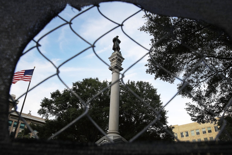 A monument featuring a statue of a Confederate soldier is seen in Hemming Park.