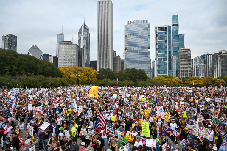 Demonstrators protest during the "No Kings" march in Chicago, IL.