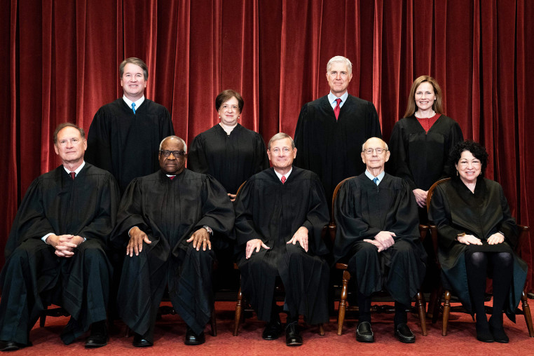 Seated from left: Associate Justice Samuel Alito, Associate Justice Clarence Thomas, Chief Justice John Roberts, Associate Justice Stephen Breyer and Associate Justice Sonia Sotomayor, standing from left: Associate Justice Brett Kavanaugh, Associate Justice Elena Kagan, Associate Justice Neil Gorsuch and Associate Justice Amy Coney Barrett.