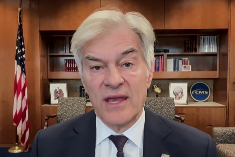 Mehmet Oz speaks while seated in an office