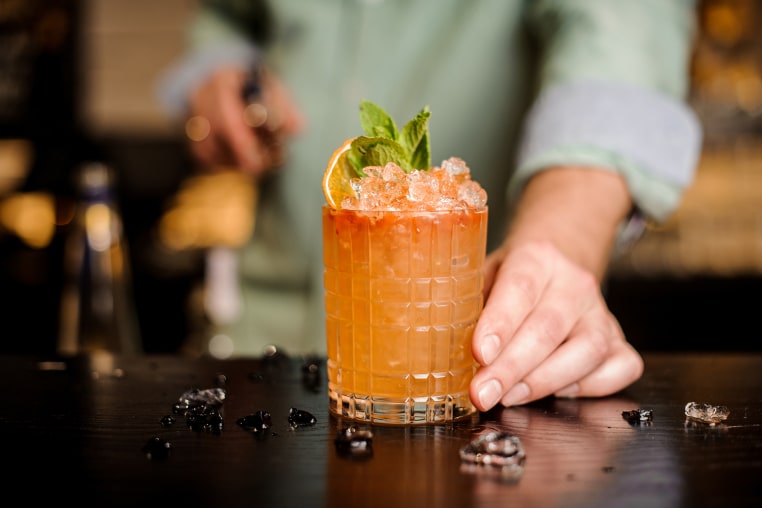 Bartender finished decorating his cocktail