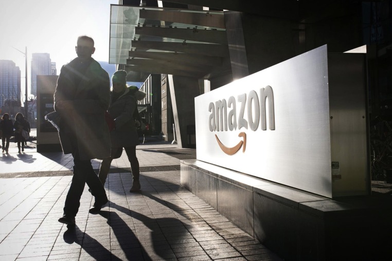 Pedestrians outside an Amazon office.
