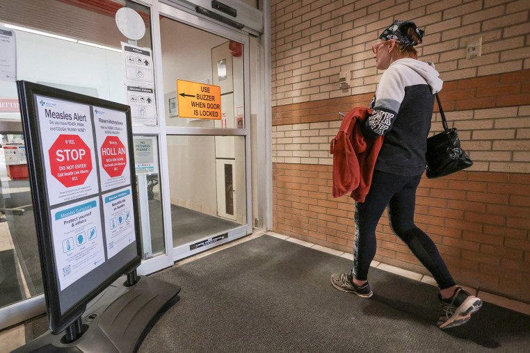 "Measles Alert" signs at the Taber Health Centre in Alberta on Oct. 27, 2025.