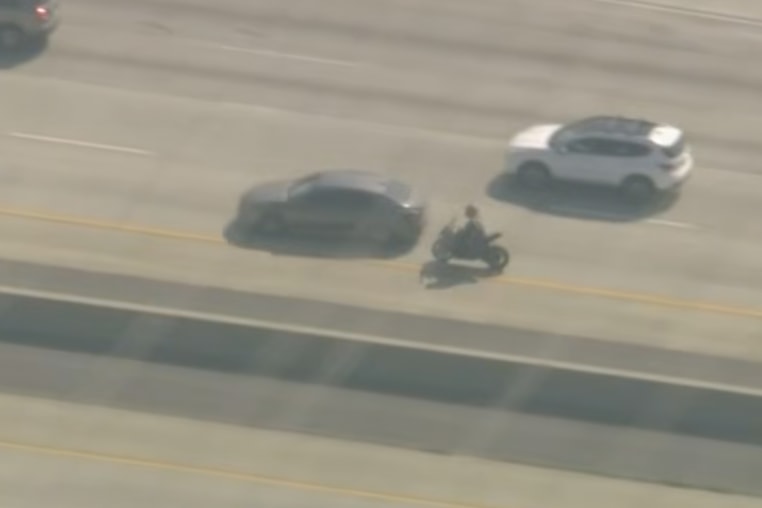 An off-duty sheriff's deputy in an unmarked car drove into the path of a motorcyclist wanted in connection with the killing of another deputy, bringing an end to a high-speed chase in Southern California on Monday.