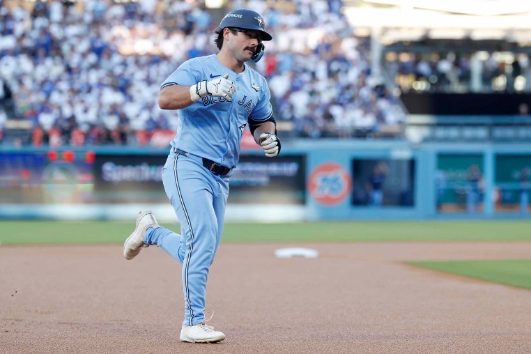 Davis Schneider of the Toronto Blue Jays rounds the bases after hitting a home run against the Los Angeles Dodgers during the first inning in game five of the 2025 World Series at Dodger Stadium on Wednesday.