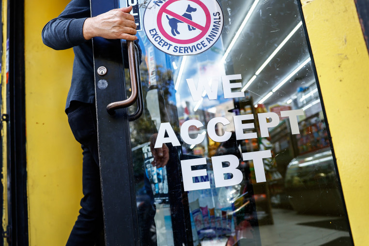 Electronic Benefit Transfer (EBT) signage displayed outside a grocery store.