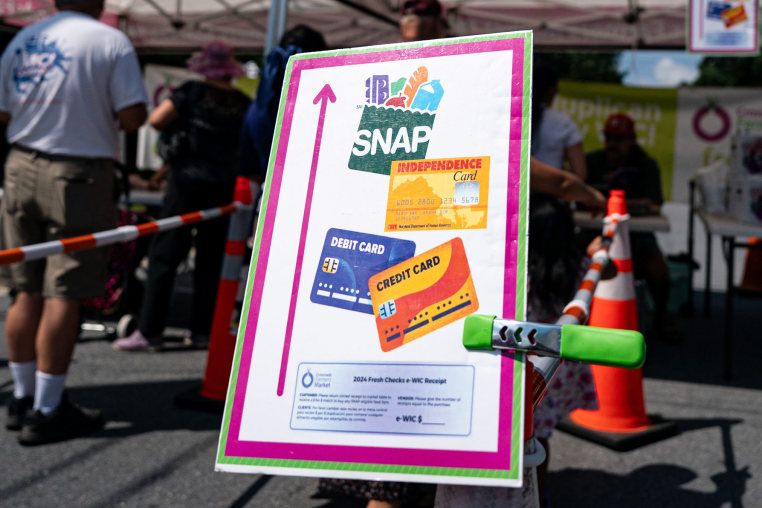 A sign advertising the acceptance of Supplemental Nutritional Assistance Program (SNAP) cards at a farmers market in Takoma Park, Maryland on July 9, 2025.