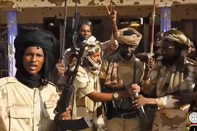 Fighters with Sudan's paramilitary Rapid Support Forces celebrate in the streets of El-Fasher in Sudan's Darfur region in an image released on the RSF Telegram account on October. 26, 2025.