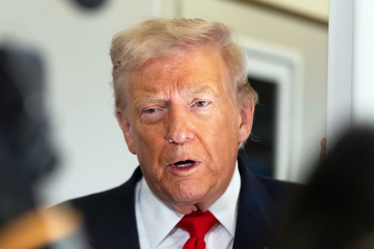 Donald Trump speaks to the media after boarding Air Force One.