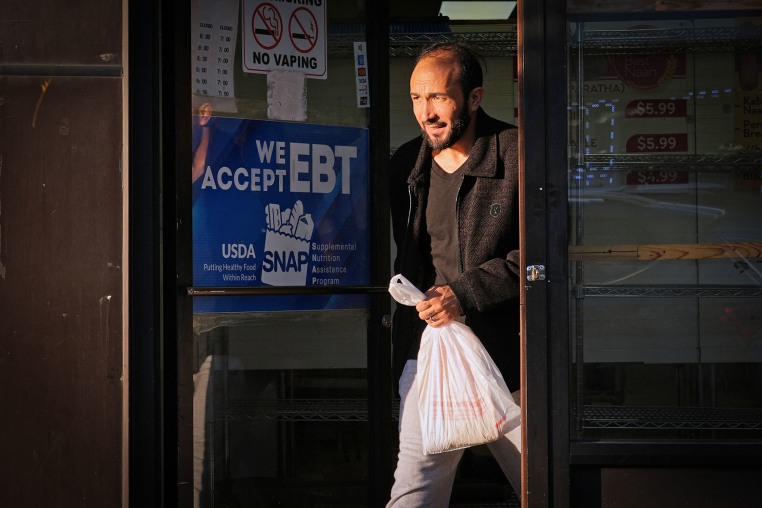 A SNAP EBT information sign in the door of a bakery in Chicago
