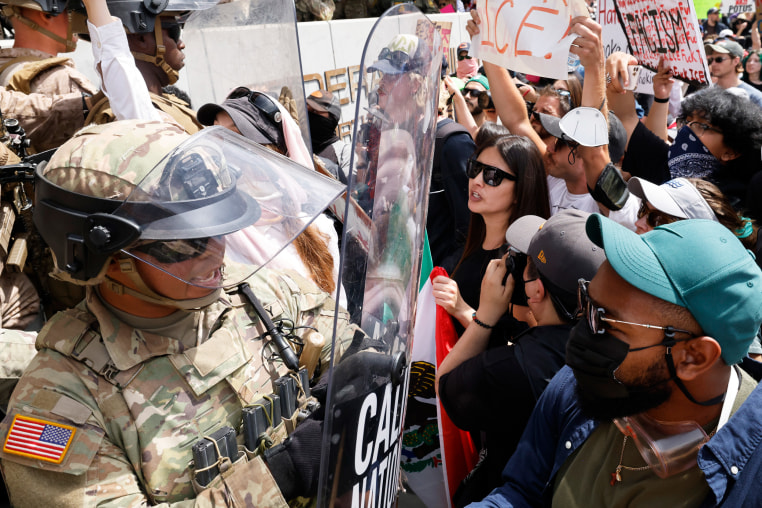 Marines push back anti-ICE protesters during "No Kings Day" in Los Angeles, C.A.