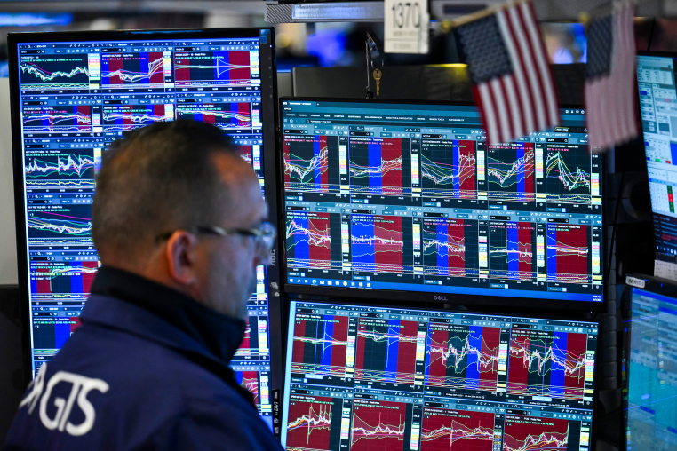 A trader works on the floor of the New York Stock Exchange.