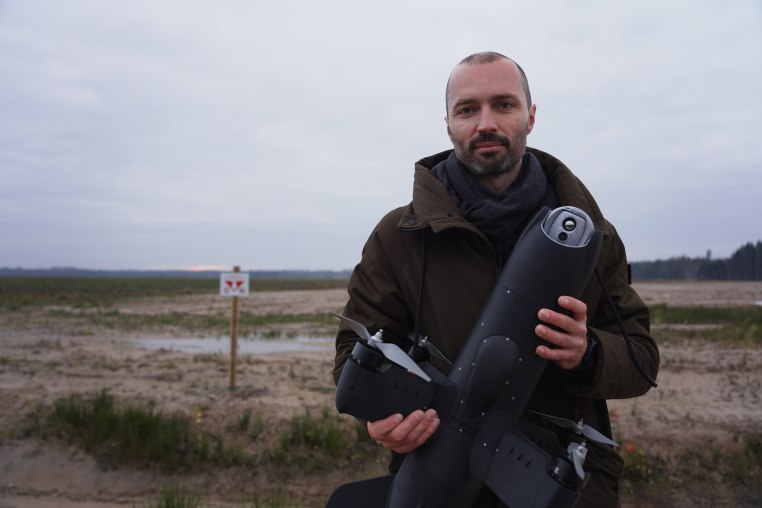 Agris Kipurs, co-founder and chief executive of Origin, holding a Blaze attack drone at an undisclosed location. 