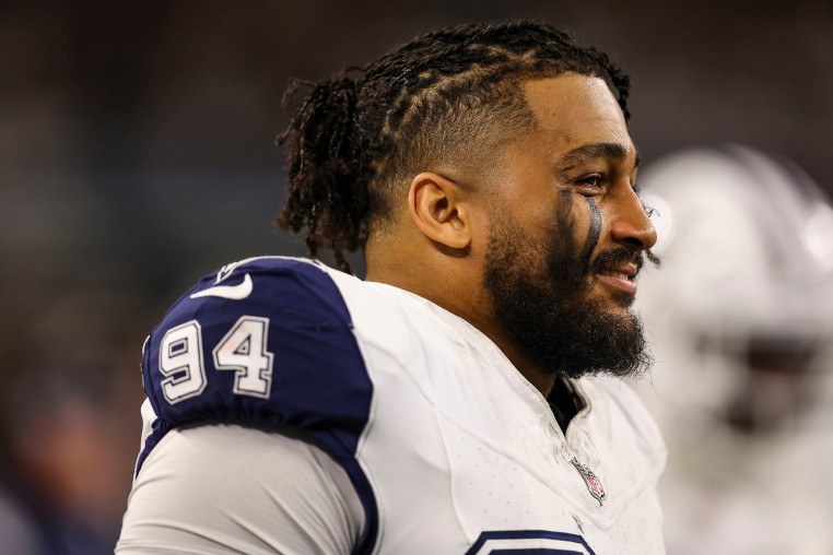 Marshawn Kneeland of the Dallas Cowboys looks on from the sideline in 2024.