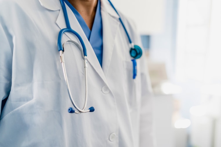 close-up of a doctor's gown with stethoscope